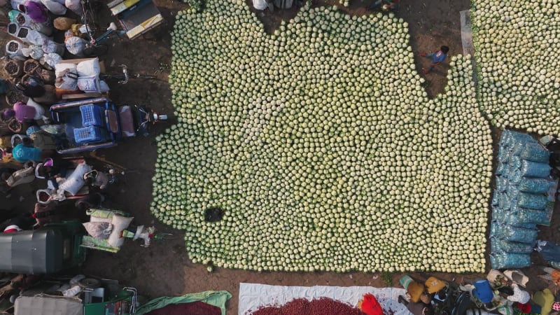 Aerial view of people in a food market in Shibganj, Rajshahi state, Bangladesh.