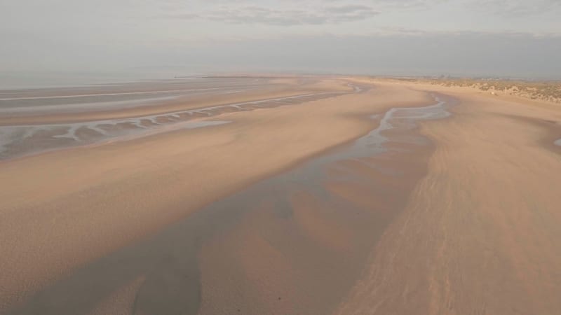 Camber Sands Beach at sunset.