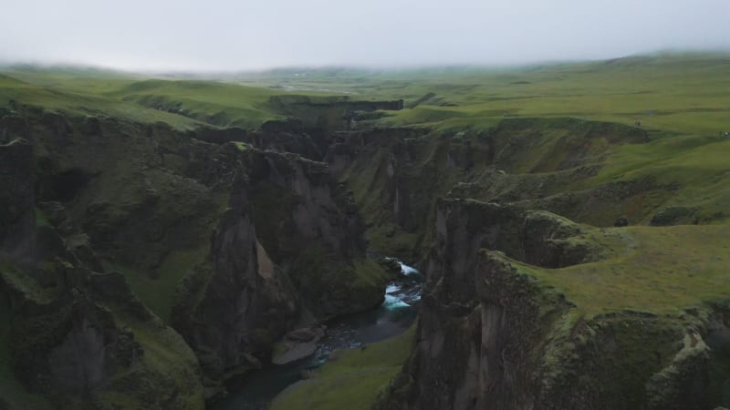 Aerial view of Fjadrargljufur canyon with waterfall, Iceland.