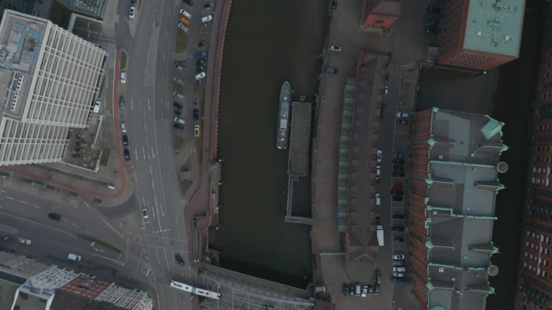 Overhead top down aerial view of cars and traffic by Elbe river canal in Hamburg city center