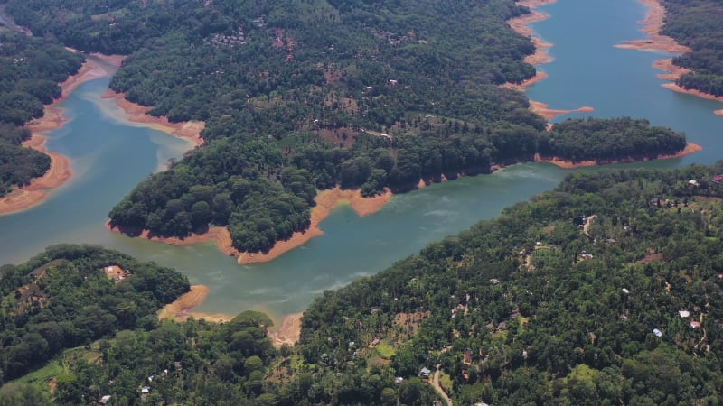 Aerial view of a river crossing the forest in Nuwara Eliya, Sri Lanka.