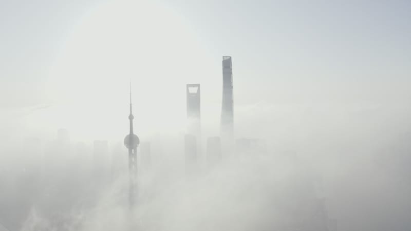 Aerial view of Shanghai financial district in early morning fog, China.