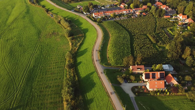 Aerial shot of a motor club riding over the dike in Culemborg, the Netherlands