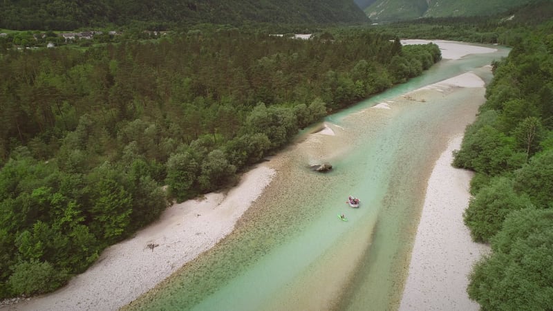 Aerial view of a group of people doing white water rafting.