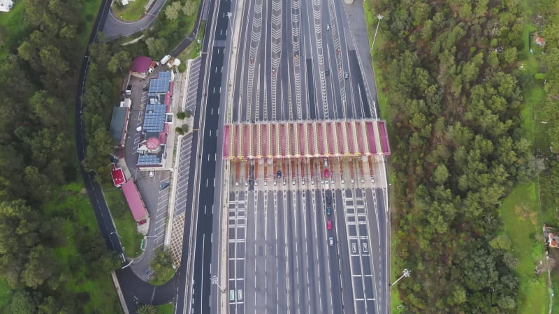 Aerial view of vehicles entering the highway from the toll box in Lisbon, Portugal.