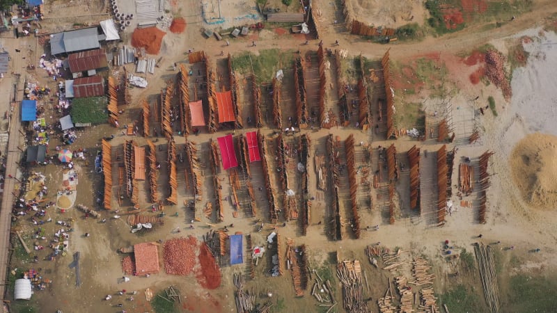 Aerial view of people working in a wood market, Baishmouja, Bangladesh.