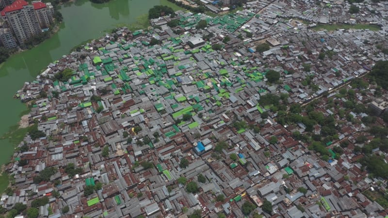 Aerial view of a large slum area along Banani lake, Dhaka, Bangladesh.