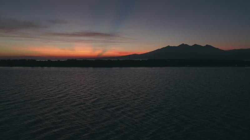 Aerial view of amazing sunset behind a mountain, Gili Trawangan.