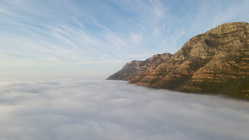 Aerial view of False bay covered in low cloud sunrise, Simonstown, Cape Town, South Africa.