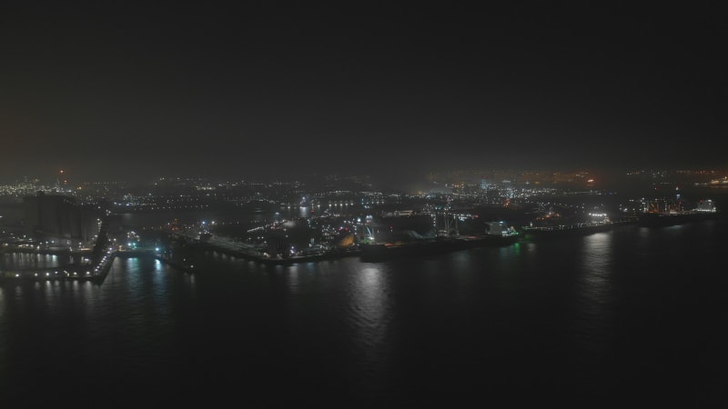 Night Time Lapse of Cargo Bulk Carrier Ship in the Harbour Moving Cargo