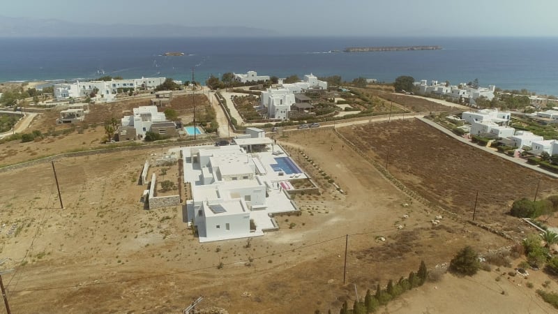 Aerial view of shore at Naousa city, with traditional white houses.