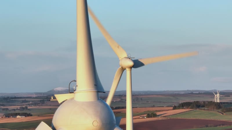 Wind Turbines at Sunset Generating Renewable Energy