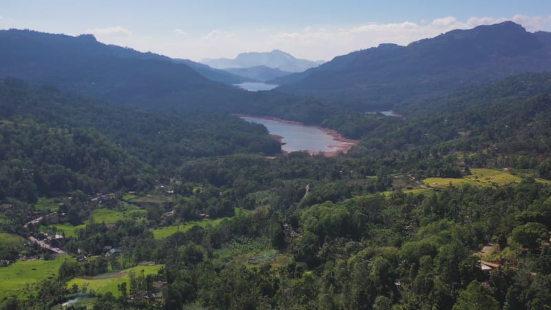 Aerial view of a river crossing the forest in Nuwara Eliya, Sri Lanka.