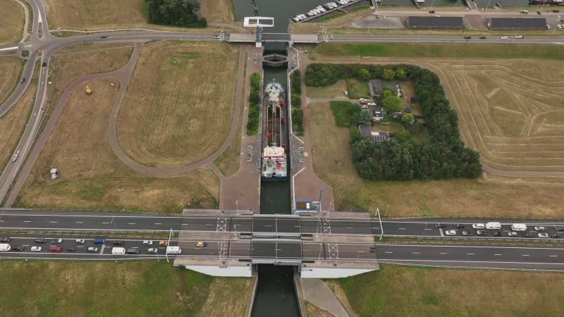 Sea Lock at Stellendam,Netherlands with Roads, moving cars,  Fishing Ships and Seagulls