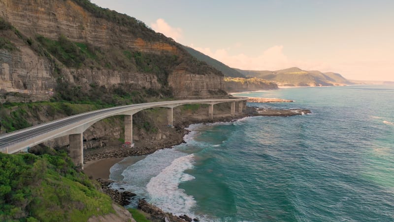 Aerial view of road crossing coastline at New South Wales.