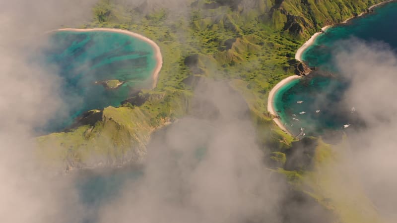 Scenic aerial view over the clouds of Padar islands during day.