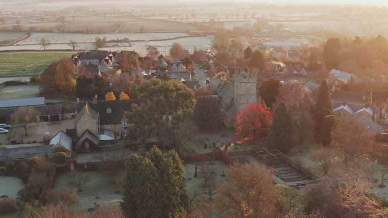 Typical English village and beautiful British countryside scenery in The Cotswolds showing a rural church at sunrise in morning sun at Longborough, Gloucestershire, England, UK