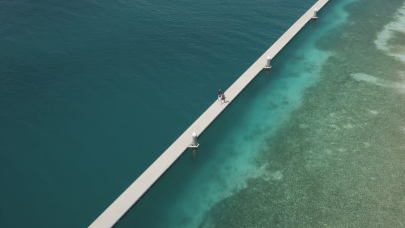 Friends Strolling on a Curacao Pier