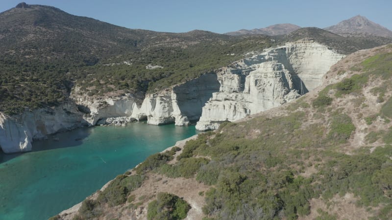 Aerial View of White Chalk Cliff with Waves Crashing on Rocks in Mykonos, Greece