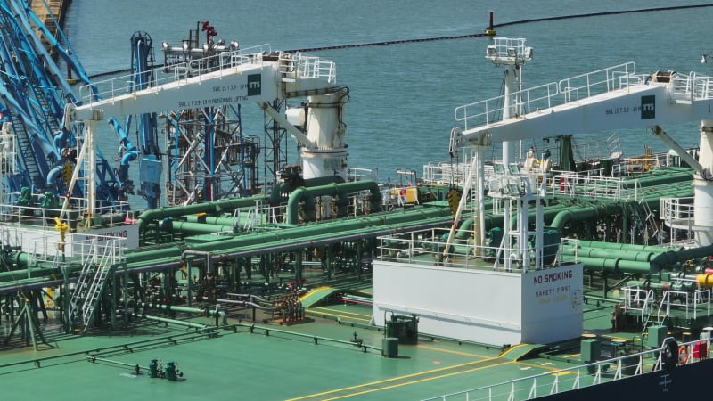 Petroleum Tanker Vessel Offloading Fuel and Oil at a Refinery Port