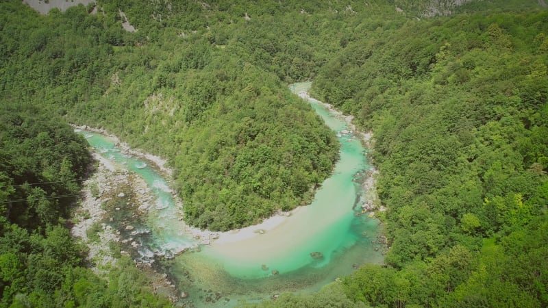 Aerial view of the calm water surrounded by nature.