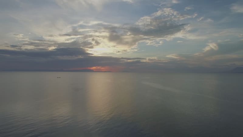 Aerial view of boat driving far away during the sunset, Kep.