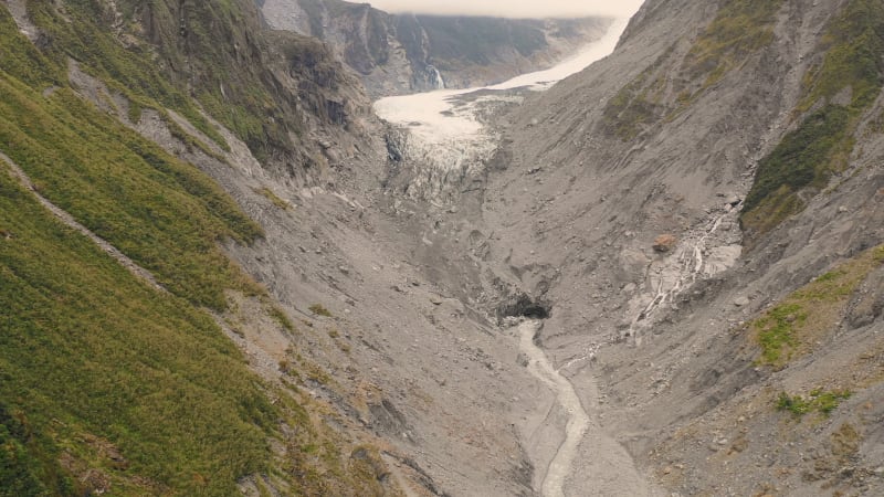 Aerial view of scenic Fox Glacier at the mountain range.