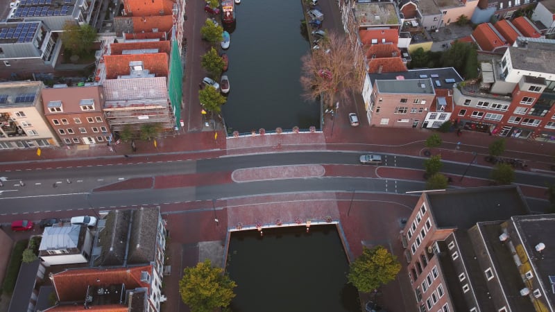 A water canal and bridge in a residential area of Leiden, South Holland, Netherlands.