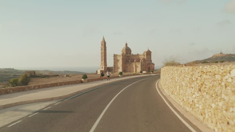 Ta Pinu Basilica Castle in dry Country of Gozo Island, Malta im Sand Brown color, Beautiful Aerial Establishing Shot forward