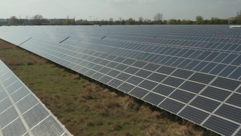 Close Up Flight over Solar Panels that produce Green, Environmentally friendly Energy from the Sun. Solar plant Park producing renewable energy for a sustainable Development