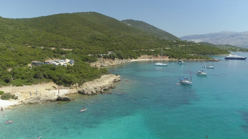 Aerial view of boats anchored in the shore of Ithaki island.