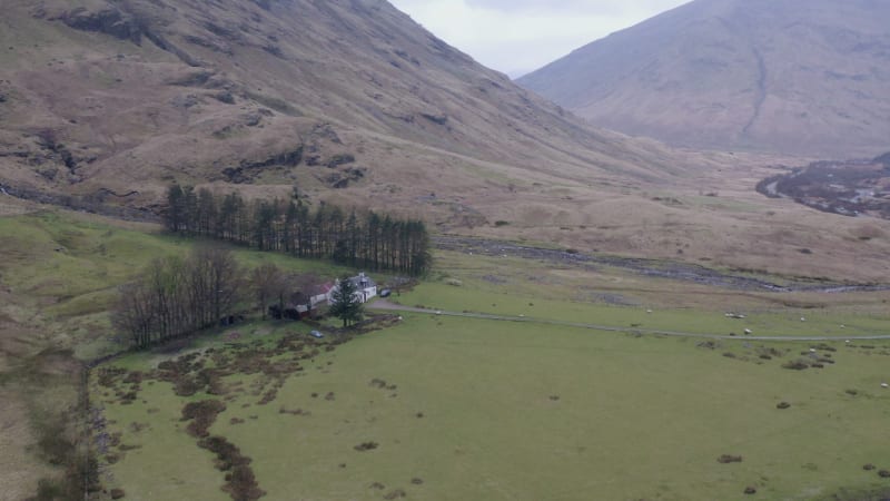 The Glencoe Valley and a Small House Surrounded by Mountains in the Highlands