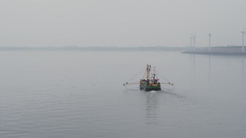 Tracking, Orbiting Shot Around a Fishing Vessel on a River