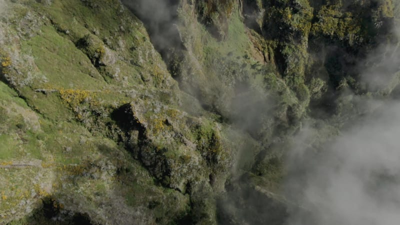 Aerial view of the mountains and the clouds at Pico Ruvio in Madeira, Portugal.