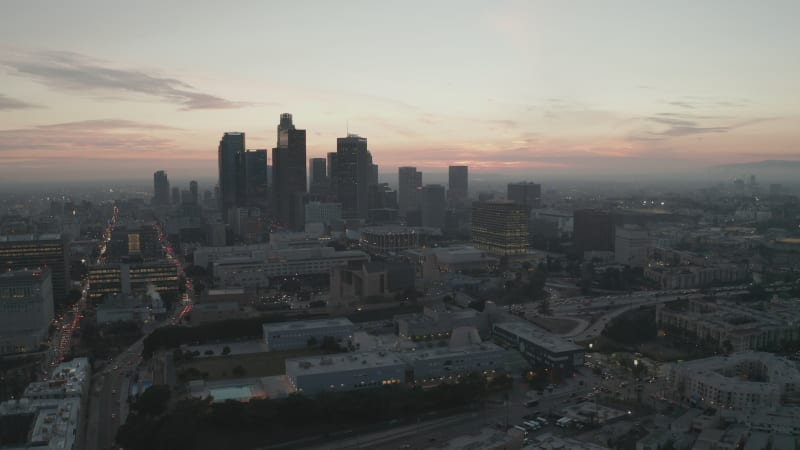 Cinematic View of Busy Downtown Los Angeles right after dusk with Skyline City Lights and Car traffic