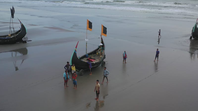 Aerial view of traditional fishing boats along the shoreline, Bangladesh.