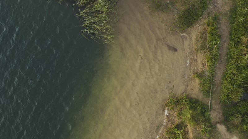 Close up view of waves washing on the lake shore