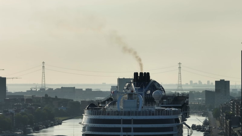 Overhead View of Cruise Ship Docked in Amsterdam Emitting Carbon Emissions