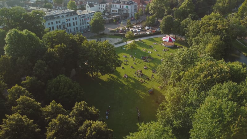 People relaxing in Park Lepeleburg on a summer day in Utrecht, the Netherlands.