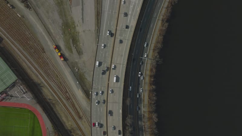 High angle view of busy highway and interchange on waterfront. Top down shot of driving vehicles. Boston, USA