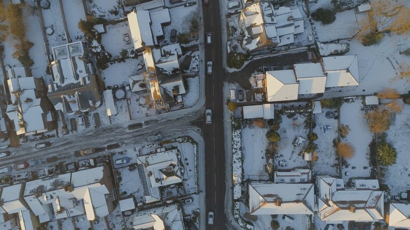 Snowy Streets and Houses in the Early Morning Bird's Eye View
