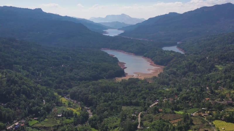 Aerial view of a river crossing the forest in Nuwara Eliya, Sri Lanka.