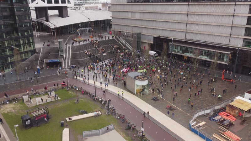 Drone panning shot footage of a climate protest in the city of Utrecht, Netherelands