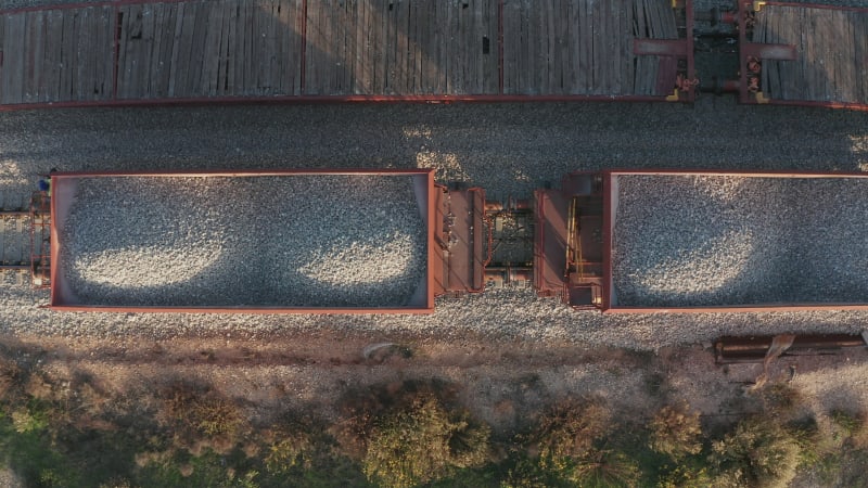 Close up view of carts full of gravel on a cargo train