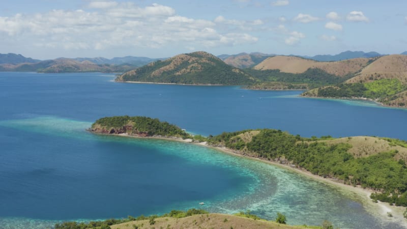 Stunning blue water behind an island mountain ridge in Philippines