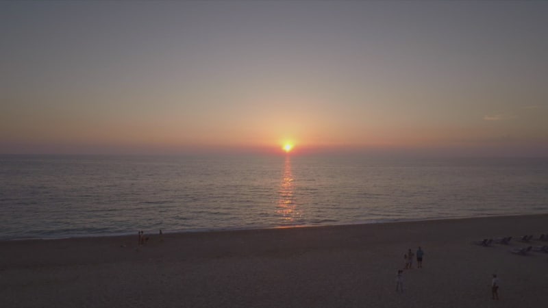 Aerial view of a sandy beach at sunset in Kathisma, Lefkas island.