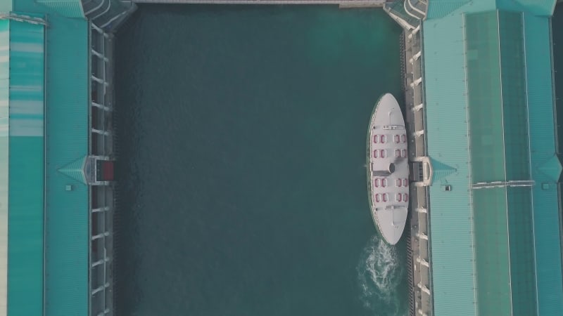 Hong Kong star ferry, central terminal and harbour front. Top down aerial drone view