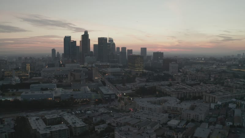 Cinematic View of Busy Downtown Los Angeles right after dusk with Skyline City Lights and Car traffic