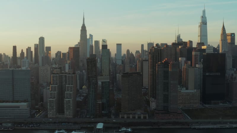 High rise buildings in midtown. Iconic Empire state building towering above surrounding development. Manhattan, New York City, USA