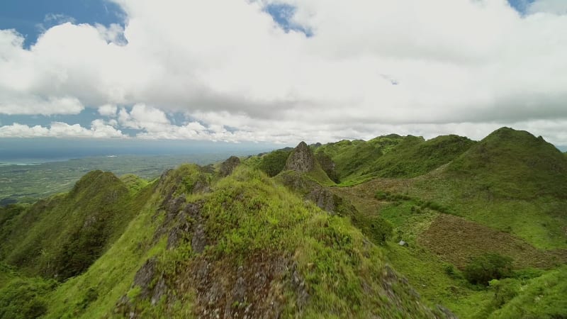 Aerial view of peak Chocolate hills and cloudy sky in Badian.